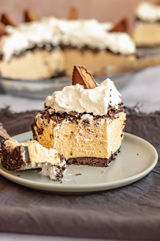 oreo peanut butter pie, A slice of peanut butter oreo pie on a plate with a bite sitting on a fork