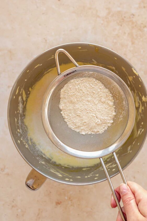 daffodil cake, Flour in a sifter going into egg yolk batter
