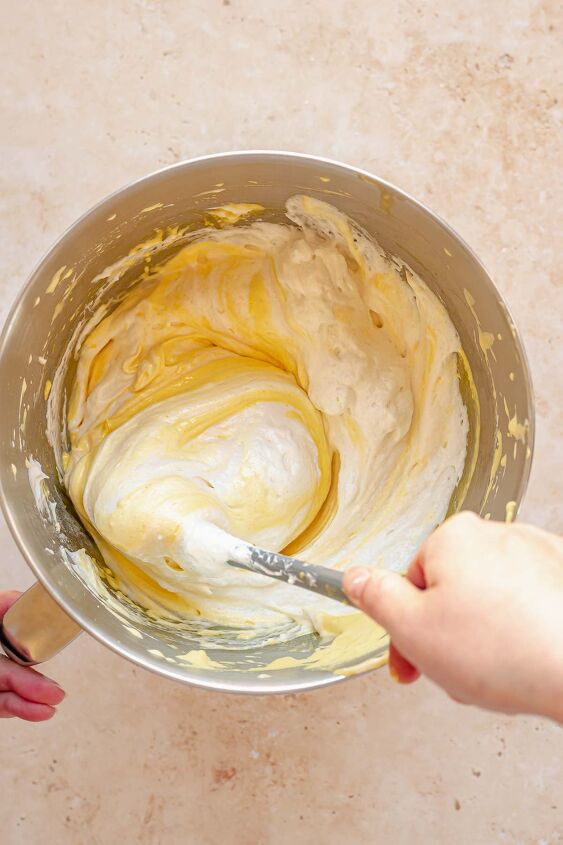 daffodil cake, A spatula folds egg whites into egg yolk batter in a bowl