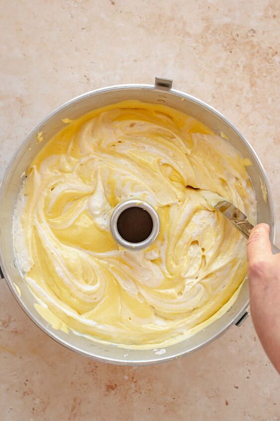 daffodil cake, A knife swirls together the batters in the tube pan