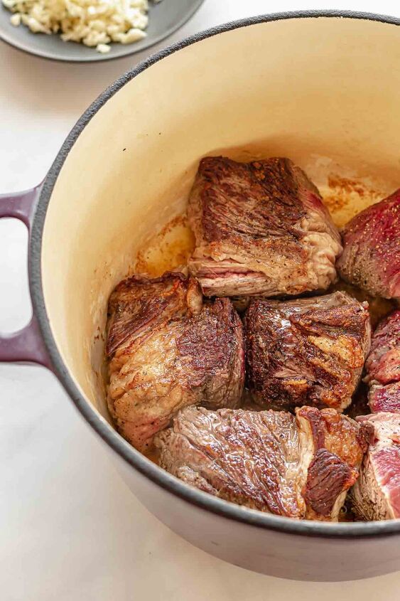 irish beef stew with cheddar dumplings, Chuck roast browning in a pot