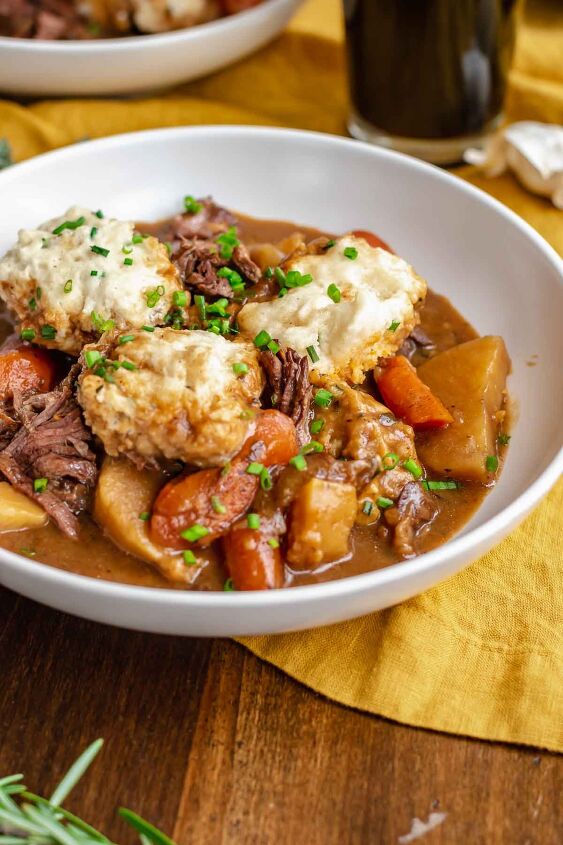 irish beef stew with cheddar dumplings, Bowl of stew with a spoon it it