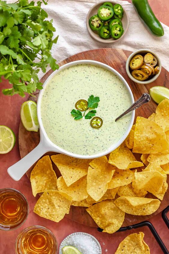 creamy jalapeno ranch dip, Jalapeno ranch dip in a bowl with chips and jalape os on the side