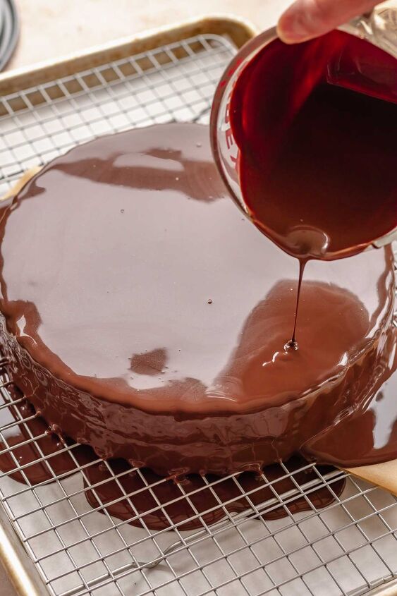 chocolate raspberry mousse cake, Chocolate ganache being poured over the cake
