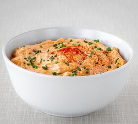 Austrian Liptauer cheese spread in a bowl topped with chives and paprika powder