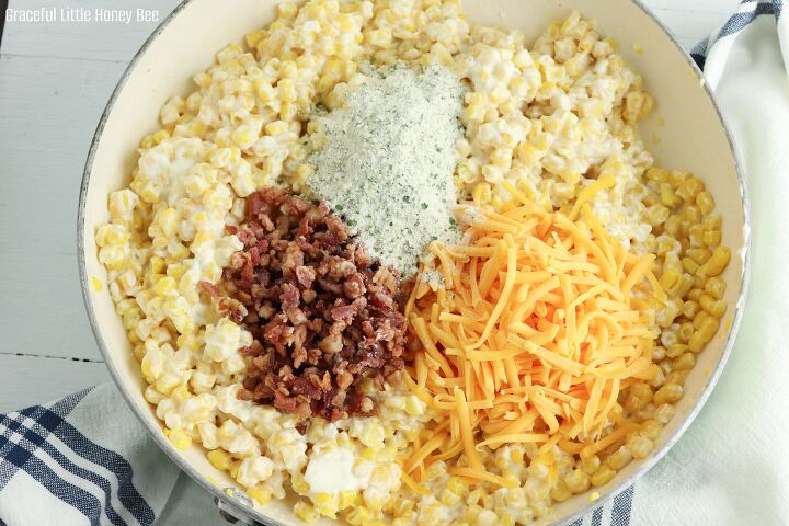 crack corn casserole, Cream cheese corn with shredded cheese crumbled bacon and ranch seasoning on top before being stirred together