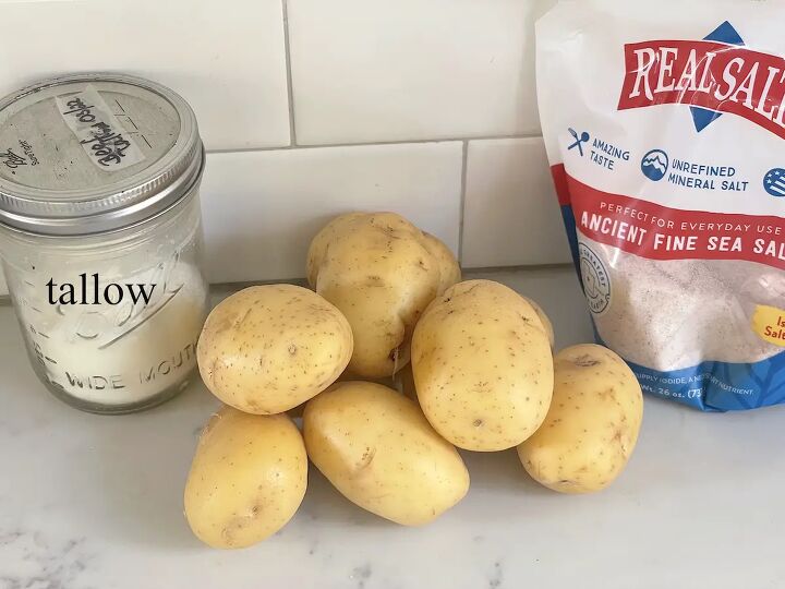 easy german fried potatoes bratkartoffeln, tallow in mason jar golden potatoes and sea salt on kitchen counter