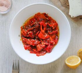 easy vegan italian roasted peppers recipe, bowl of Italian roasted pepper with a fork lemon and cheese