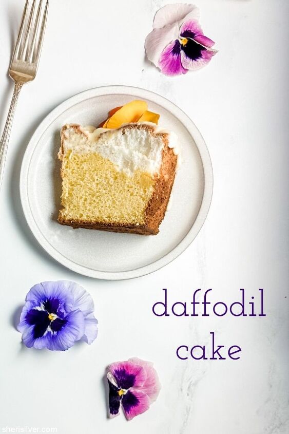 make this daffodil cake recipe for spring, daffodil cake slice on a ceramic plate with edible pansies