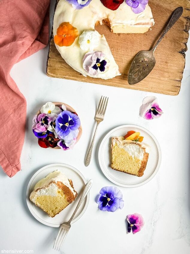 make this daffodil cake recipe for spring, daffodil cake on a wooden board next to slices of cake on ceramic plates