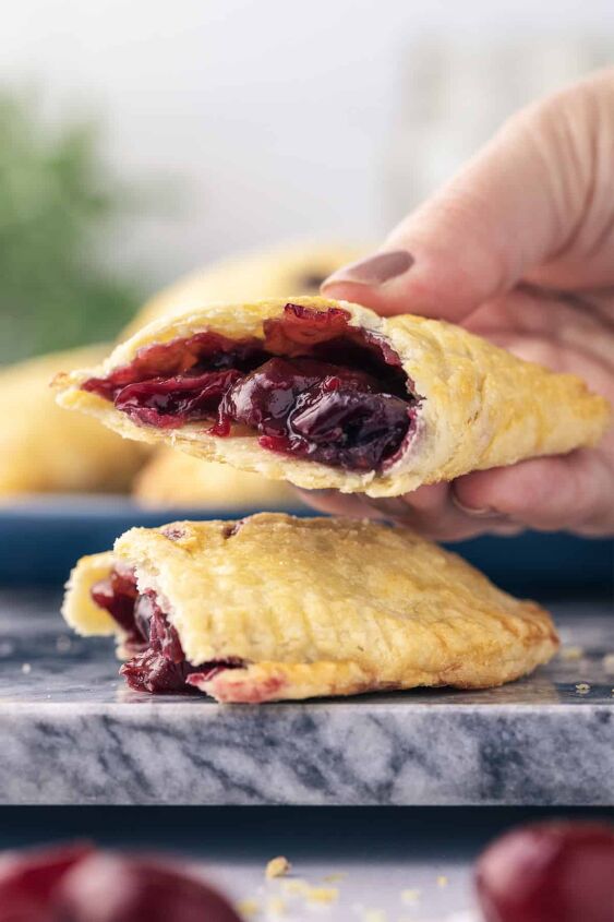 sweet cherry hand pies, A cherry hand pie that is cut in half