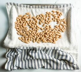 you want to make these crispy roasted white beans, white beans on a striped kitchen towel