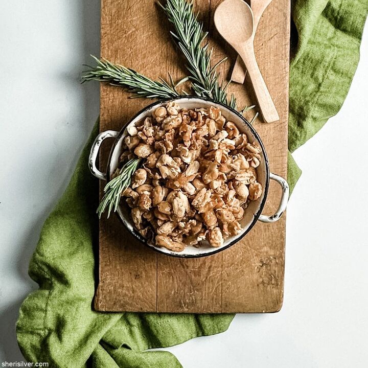 you want to make these crispy roasted white beans, crispy white beans in a mini skillet on a wooden board with green linen napkin