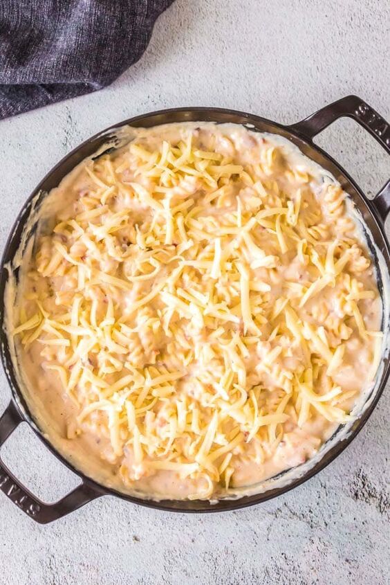 cheesy baked bechamel pasta, Bechamel pasta with cheese sprinkled over the top before being baked