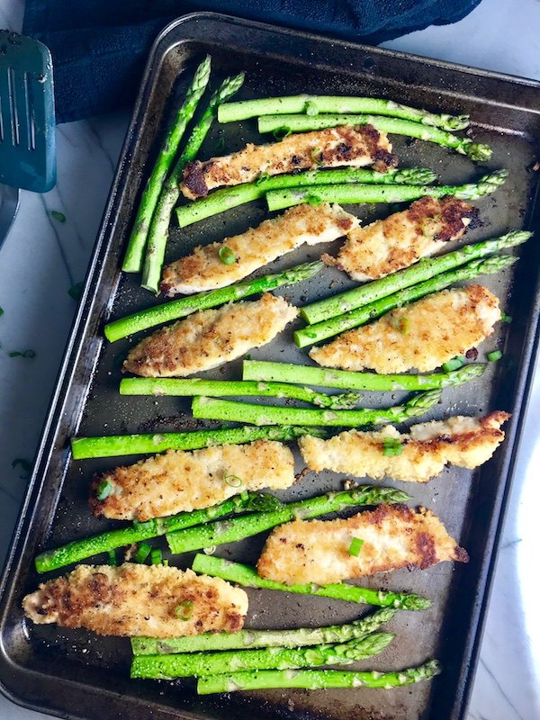 This One Pan Parmesan Crumb Chicken and Asparagus is crispy healthy filling easy and delicious The chicken is simply breaded with a mixture of parmesan cheese and breadcrumbs The Asparagus is lightly seasoned with extra virgin olive oil garlic salt and pepper Sprinkle the entire pan with scallions for a mild onion flavor and this dish is loaded with amazing but simple delicious ness
