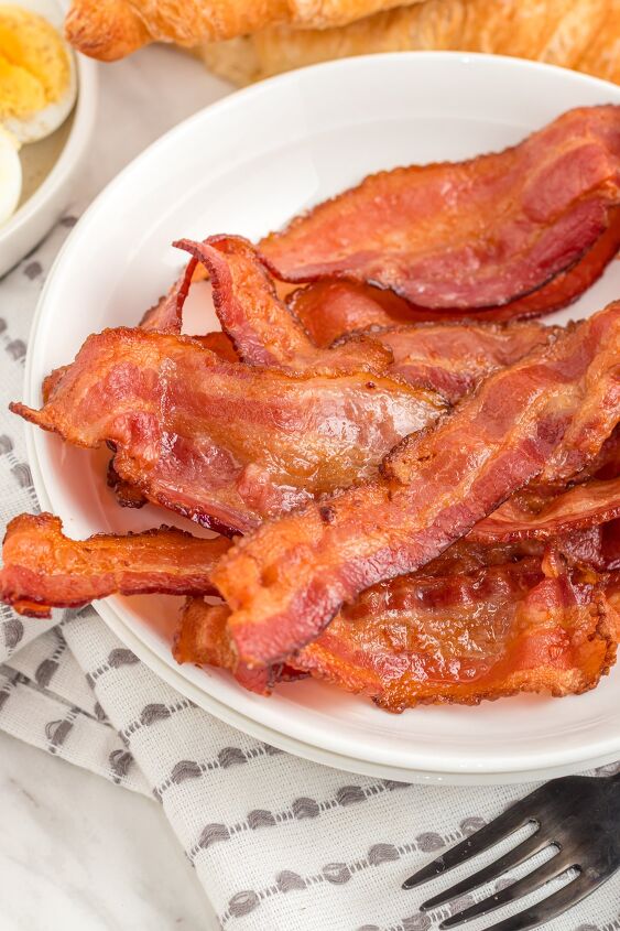 how to cook bacon in the air fryer, close up of bacon on a plate
