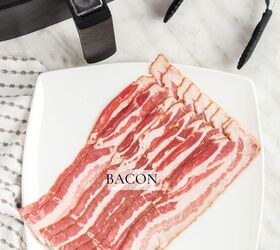 how to cook bacon in the air fryer, Bacon on a plate on counter beside the air fryer