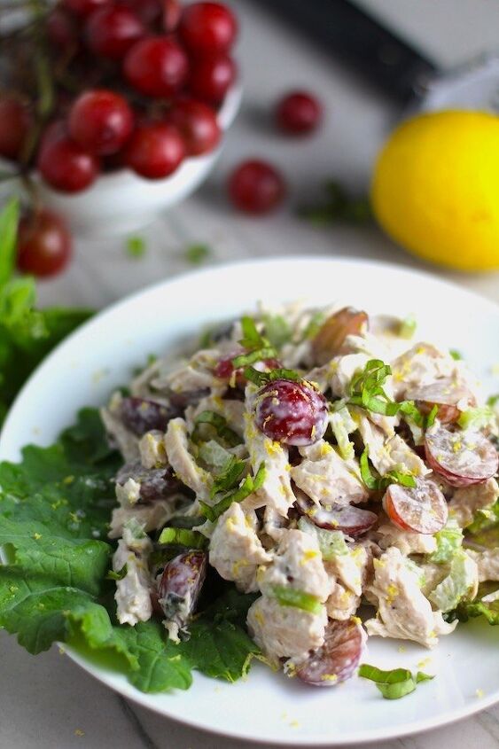 easy chicken salad with grapes, Lemon Basil Chicken Salad with Grapes on a plate on counter with grapes and lemon in background This recipe is simple but the taste is anything but simple It has layers of flavors and textures You get the hearty texture of the chicken brightness from the lemon the fresh and fragrant basil a slight bite from the onion and a huge juicy burst of sweetness from the grapes