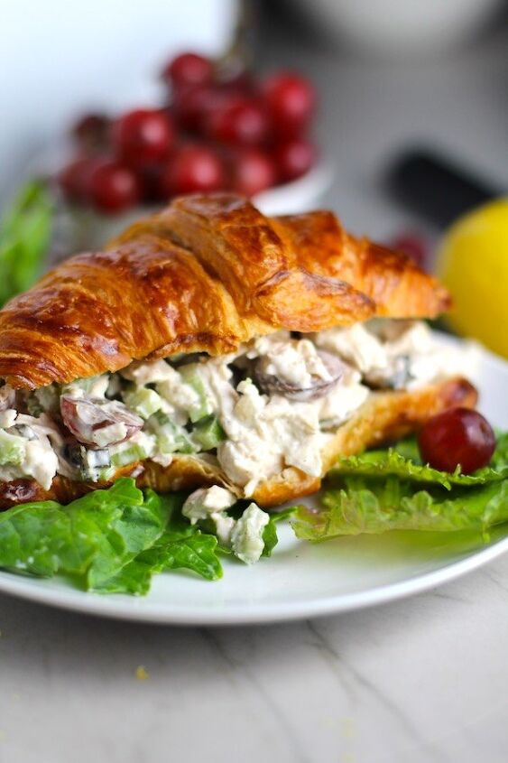 easy chicken salad with grapes, Lemon Basil Chicken Salad with Grapes on a croissant on plate with lettuce and grapes in background This recipe is simple but the taste is anything but simple It has layers of flavors and textures You get the hearty texture of the chicken brightness from the lemon the fresh and fragrant basil a slight bite from the onion and a huge juicy burst of sweetness from the grapes