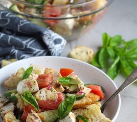 panzanella toscana with chicken and mozzarella, Chicken Panzanella Salad Recipe in a bowl with fork It has Toasted bread cubes chicken tomatoes cucumber basil and mozzarella Serving bowl in back