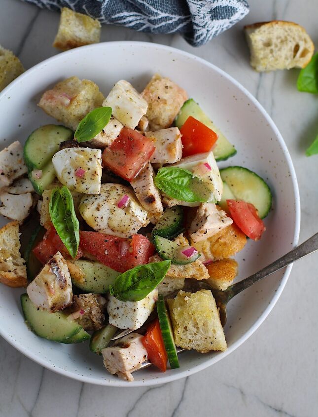 panzanella toscana with chicken and mozzarella, Toasted bread cubes chicken tomatoes cucumber basil and mozzarella in a bowl for this Chicken Panzanella Salad Recipe It s absolutely delicious