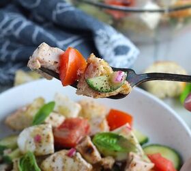 panzanella toscana with chicken and mozzarella, Toasted bread cubes chicken tomatoes cucumber on a fork over a bowl of Chicken Panzanella Salad Recipe It s absolutely delicious
