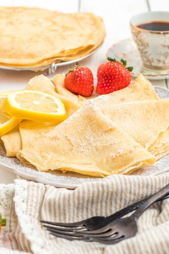 parisian crepes will make you the star of brunch, Parisian Cr pes on a plate with lemon and strawberries and espresso