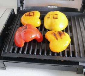 grilled peppers with feta cheese, vegetables cooking on an indoor grill