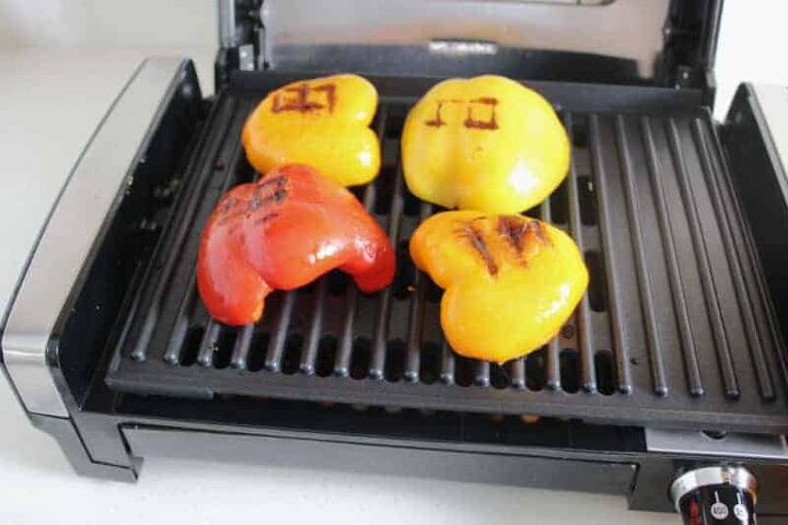 grilled peppers with feta cheese, vegetables cooking on an indoor grill