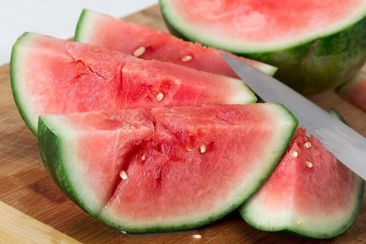 watermelon cooler recipe, slices of watermelon on a cutting board