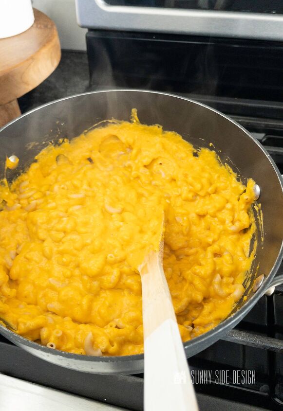 the best healthy mac and cheese recipe, Stir in cooked whole wheat pasta in the the butternut squash mac and cheese sauce