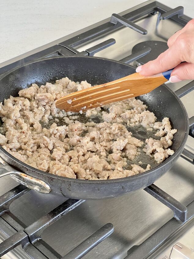 an easy spicy sausage muffin recipe for breakfast, Browning pork sausage in a skillet on a stovetop