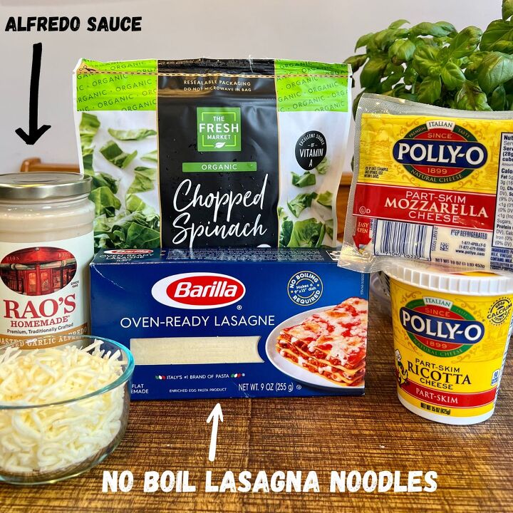 easy meatless white spinach lasagna, White lasagna ingredients Rao s Alfredo sauce lasagna noodles shredded mozzarella chopped spinach ricotta cheese and a basil plant on a wooden table