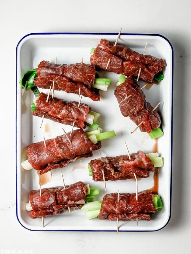 make this easy beef scallion negimaki recipe tonight, flank steak rolled with scallions in an enamel pan