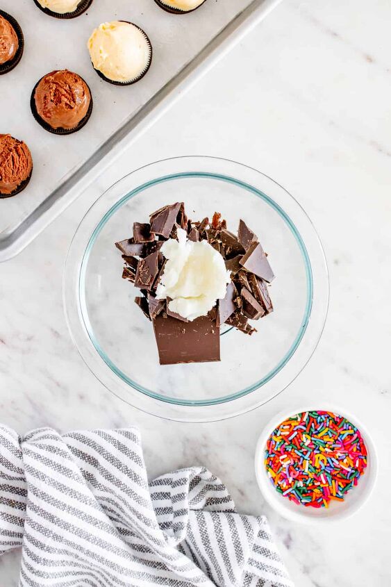 chocolate covered ice cream bites with oreos, A bowl of coconut oil and chocolate next to a bowl of sprinkles