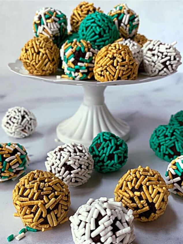 blueberry scones with lemon glaze, Chocolate truffles on a white pedestal rolled in green white and gold sprinkles