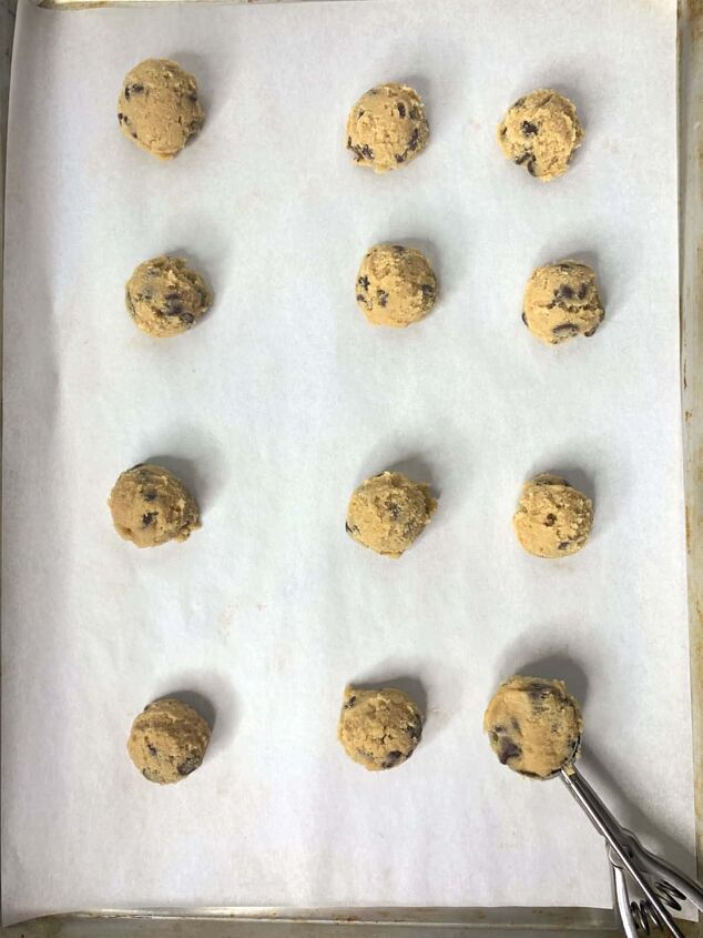 small batch chocolate chip cookies, A baking sheet with chocolate chip cookie dough balls on it