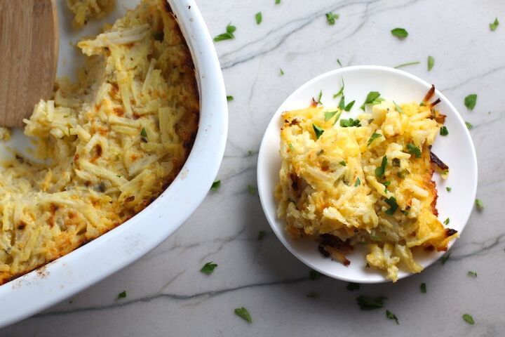 cheesy hash brown casserole without soup, Cheesy Hash Brown Casserole on plate and in casserole dish on counter This recipe does not disappoint It s warm creamy and full of flavor And it s the perfect side dish for your holiday dinner