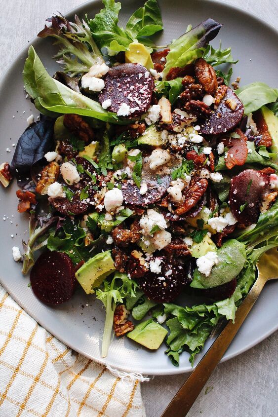 beet and avocado salad with bacon and feta too, beet and avocado salad on a gray plate