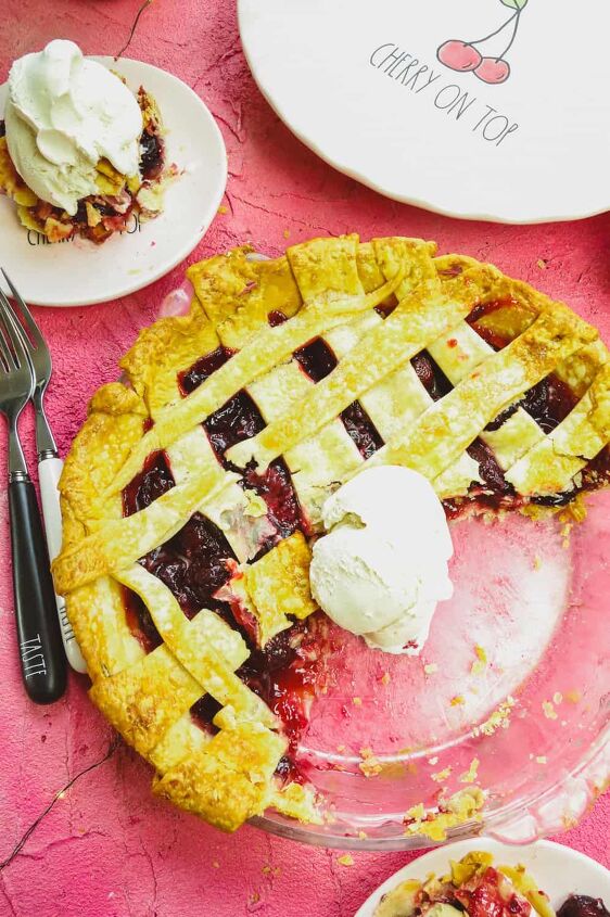 refined sugar free cherry pie, half of a homemade pie with ice cream sitting on top