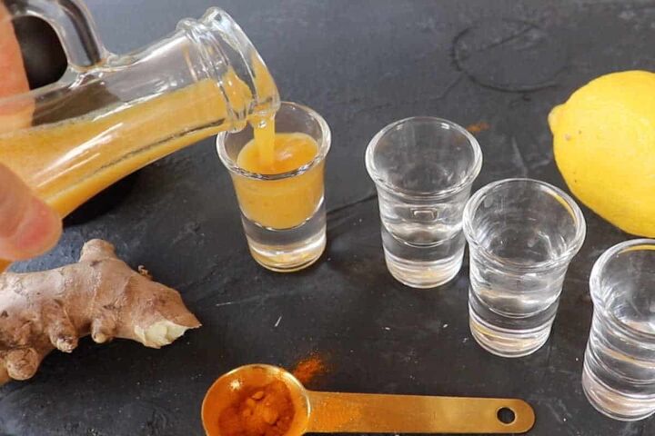 lemon ginger turmeric shot recipe, pouring Lemon ginger turmeric juice into shots