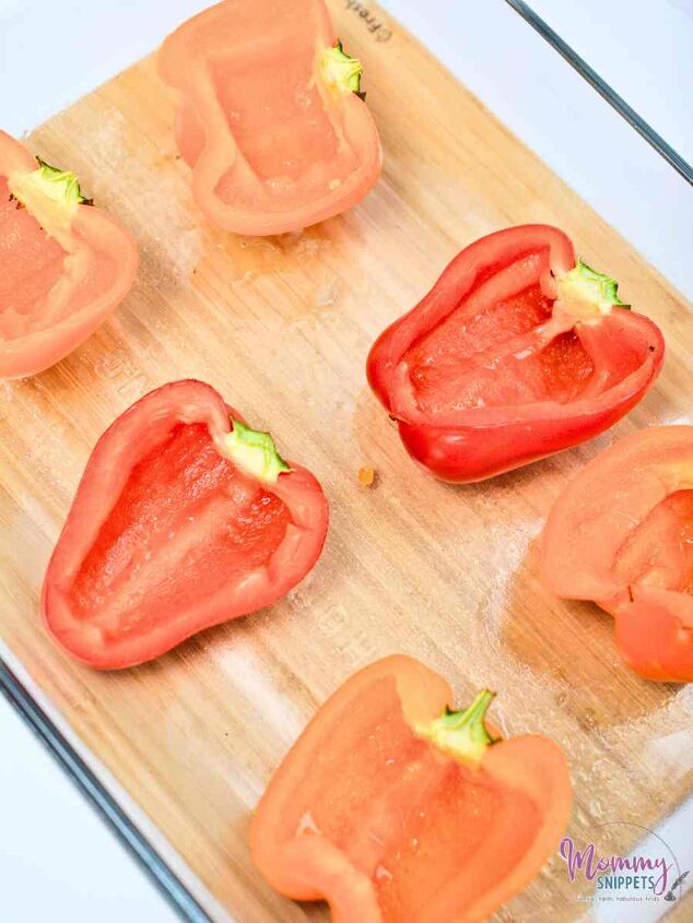 an easy lasagna inspired meat and cheese stuffed peppers keto recipe, cut peppers halved and seeded for Lasagna Inspired Meat and Cheese Stuffed Peppers