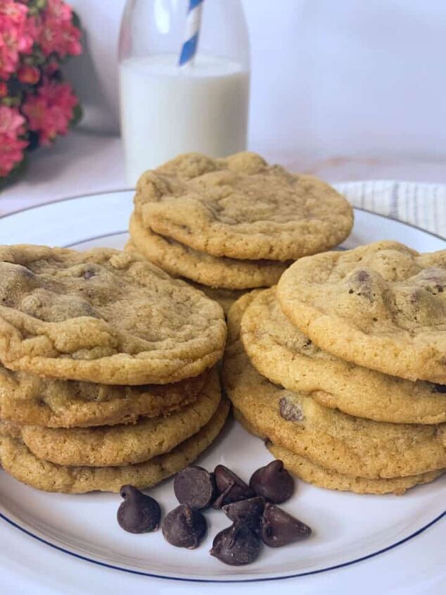 homemade cheddar cheese crackers, Three stacks of chocolate chip cookies on a white plate