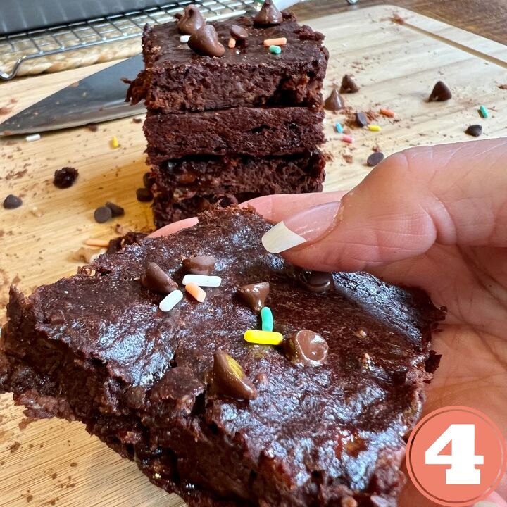 easy 3 ingredient brownies with bananas, A hand holding a three ingredient chocolate brownie