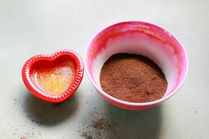 chocolate coffee ganache with raspberries, A red heart shaped bowl of melted butter with a pink bowl filled with cocoa butter and graham cracker crumbs