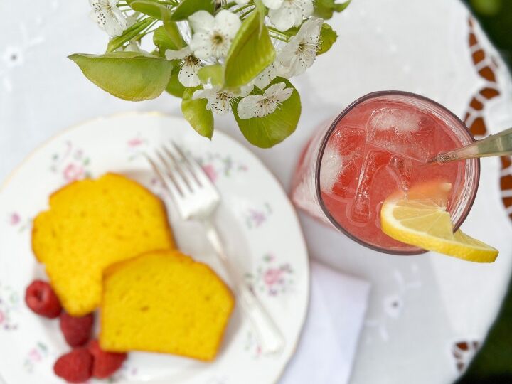 the recipe for raspberry cordial from anne of green gables, a table with raspberry cordial lemonade with lemon cake