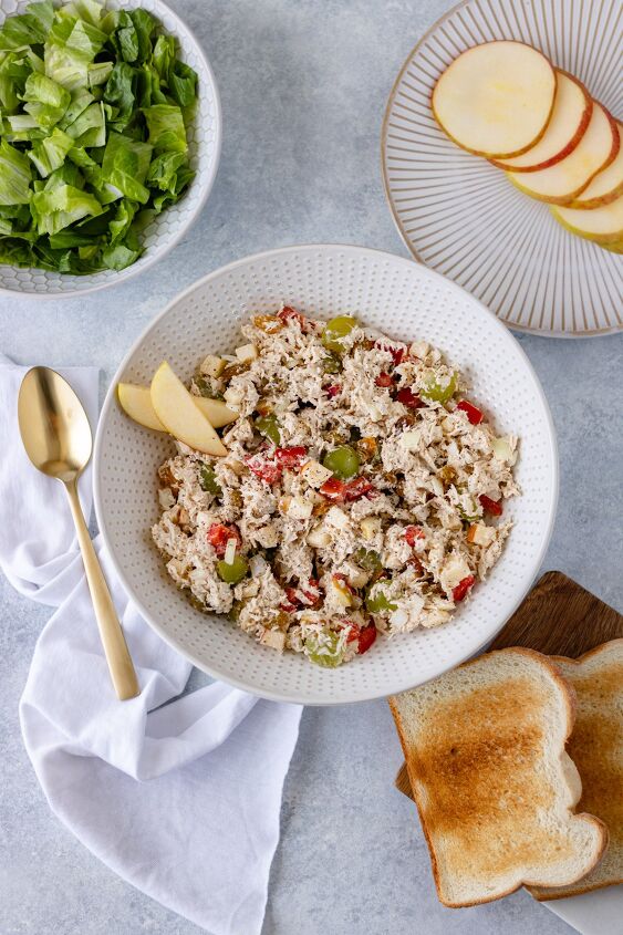 easy chicken salad recipe, Shredded chicken diced apple bell pepper onion grapes and raisins mixed with mayo in a large serving bowl