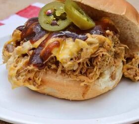 bbq pork in the oven, Pulled Pork Sandwich Topped With Cheddar Cheese Jalapenos and BBQ Sauce