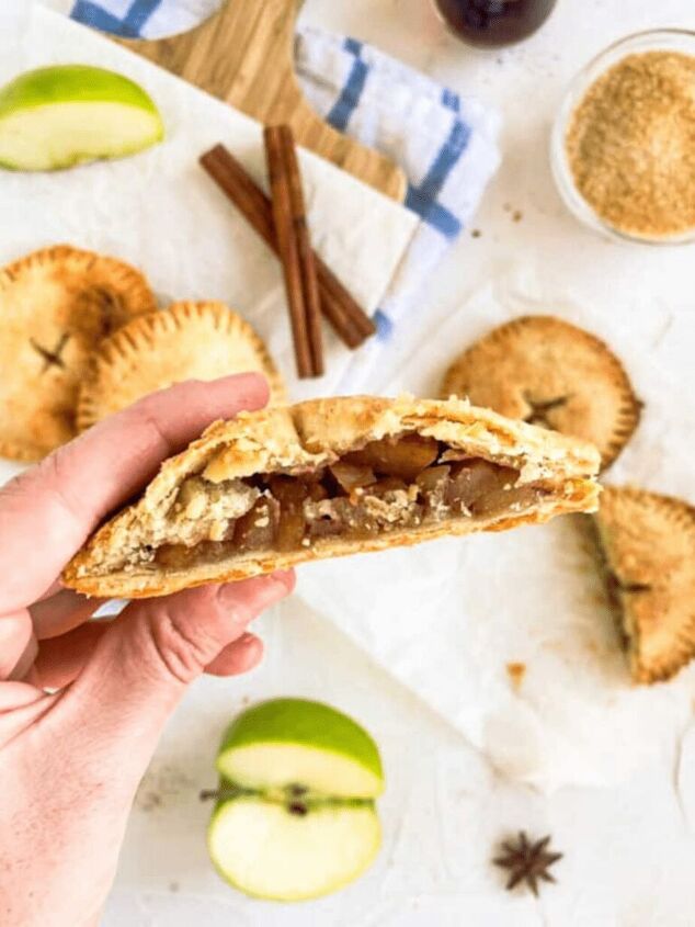 easy vegan hand pies apple, Vegan apple hand pie cut open to show the inner pie filling with a white background with apples cut open