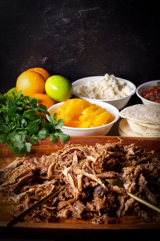 camping tacos shredded pork with pico de gallo, A wood tray filled with shredded pork for tacos